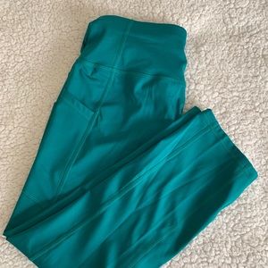 Athletic woman’s green leggings